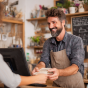 vitriolicnaivety_A_small_business_owner_handing_a_free_helpfu_1b332388-3d0a-4c55-b927-2ef4864a10ac_3